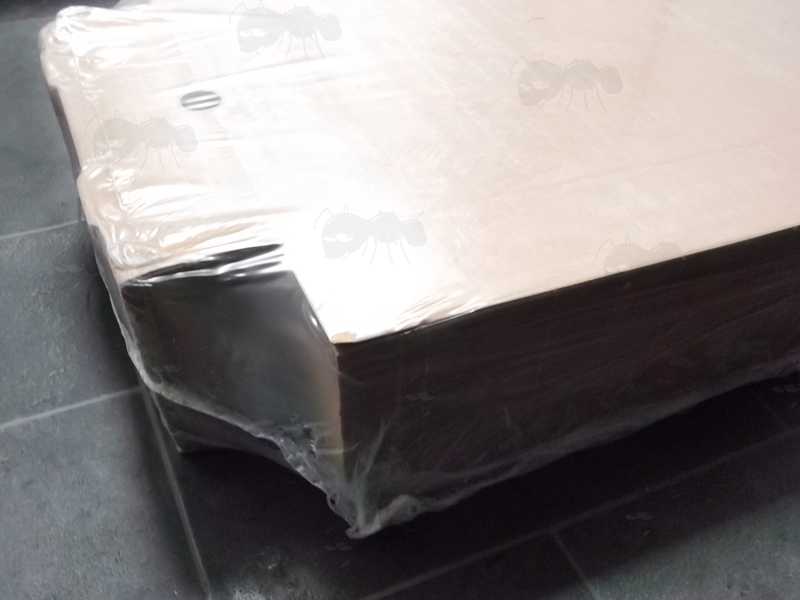 Side View of The Shrink Wrapped Pack of Flat-Packed Brown Cardboard Calzone Pizza Boxes with Integral Lids