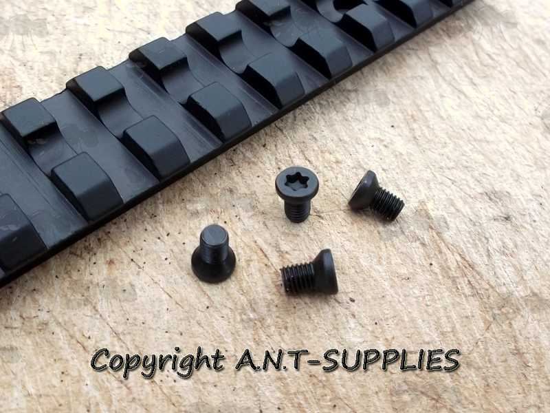 Pack of Four 6-48 Replacement Scope Rail / Mount Screws with Countersunk T10 Heads Next to a Ruger 10/22 Low Profile Picatinny Rail