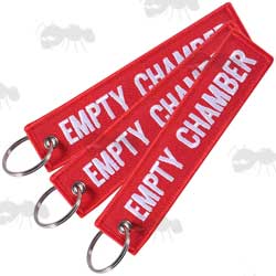 Three Red Gun Safety Keyrings with Embroidered Black Thread Remove Before Firing Text