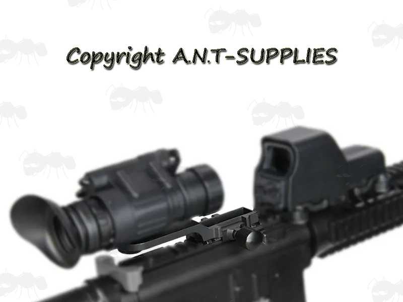 Black Metal Rail Mount for PVS-14 Style Night Vision Monoculars, Shown in Use on Rail with EoTech Holosight