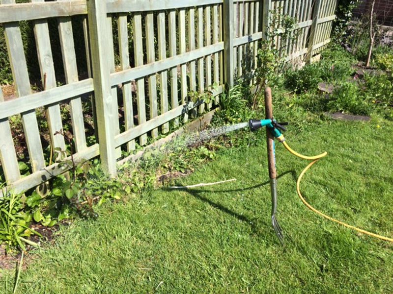 Hose Pipe Secured to Garden Fork with an Inline Rubber and Velcro Universal Mount