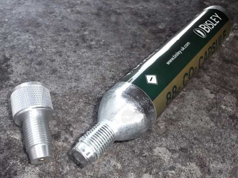 Large 88g Bisley Co2 Capsule with M16x1.5mm Threaded Fitting End, with a Silver Coloured One Way Air Saver Valve Adapter Fitted