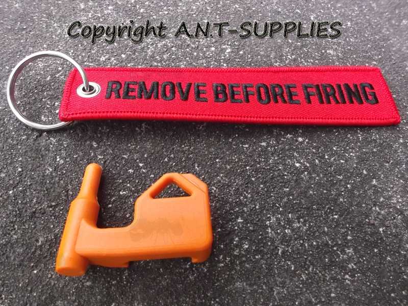 Orange Plastic Empty Gun Chamber Safety Plug Tool Fitted with Red Canvas Flag Keychain with Black Embroidered Remove Before Firing Text