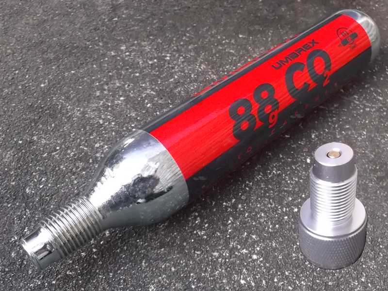 Large 88g Umarex Co2 Capsule with M16x1.5mm Threaded Fitting End, with a Silver Coloured One Way Air Saver Valve Adapter