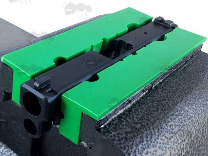 Pair of Green Soft Jaw Plates with Magnets for Gunsmiths Workbench Vice, Shown with Handgun