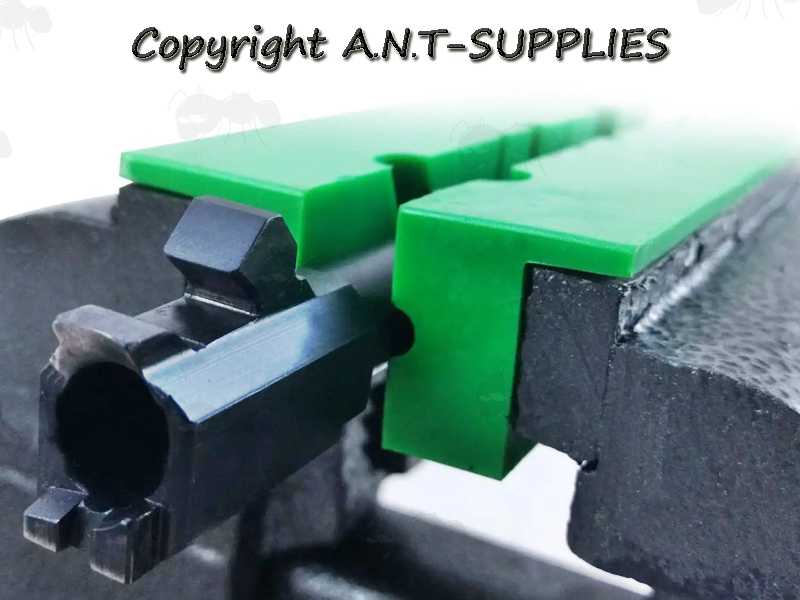 Pair of Green Soft Jaw Plates with Magnets for Gunsmiths Workbench Vice, Shown with Barrel