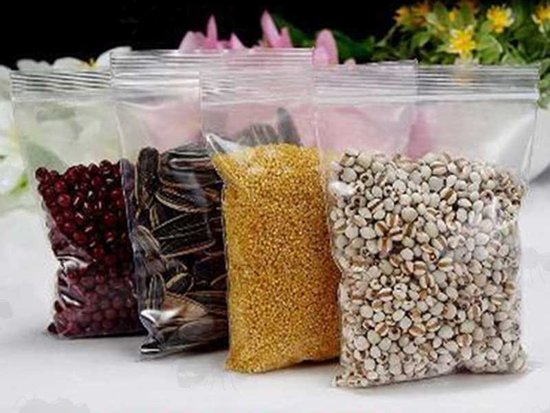 Resealable Polythene Clear Plastic Grip Seal Bags Shown Filled with Seeds