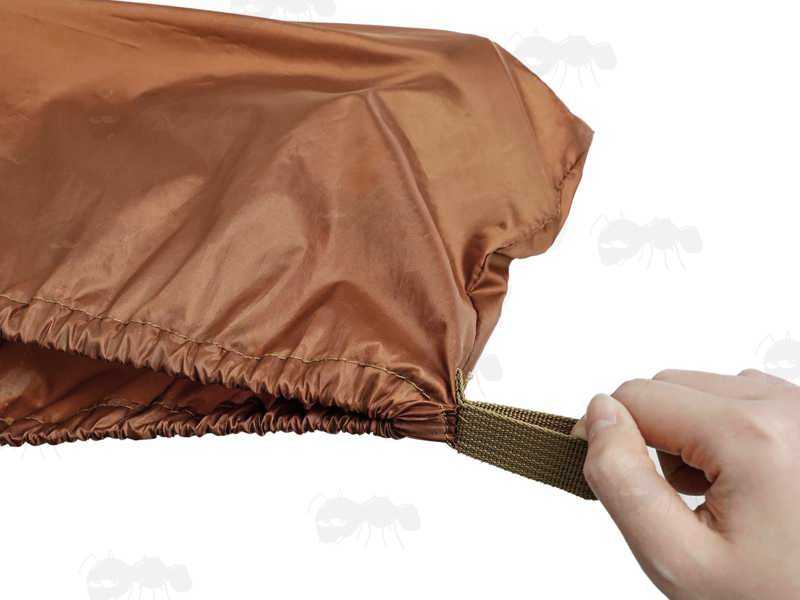 Close Up View of The Elasticated Rim on The Brown Coloured Waterproof Quick Fitting Gun Cover for Gun with Silencer, Scope and Bipod Fitted