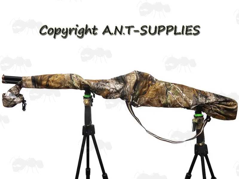 Elasticated Rim Tree Camouflage Patterned Rifle Cover Slip Hood, Shown Over Rifle on Tripod Rests