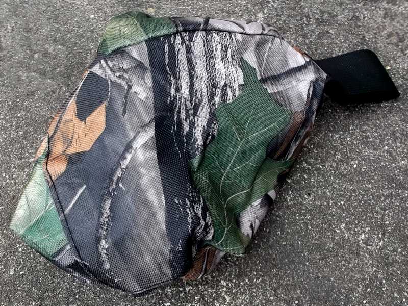 Rolled-Up View of The Dark Tree Camouflage Coloured Elastic Rifle Cover Slip Bag with Elasticated Rim for Gun with Silencer, Scope and Bipod Fitted
