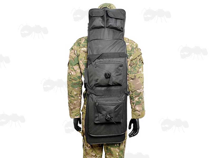100cm Long Black Canvas Rifle Backpack Case Being Carried On Manakin With Multicam Jacket and Trousers