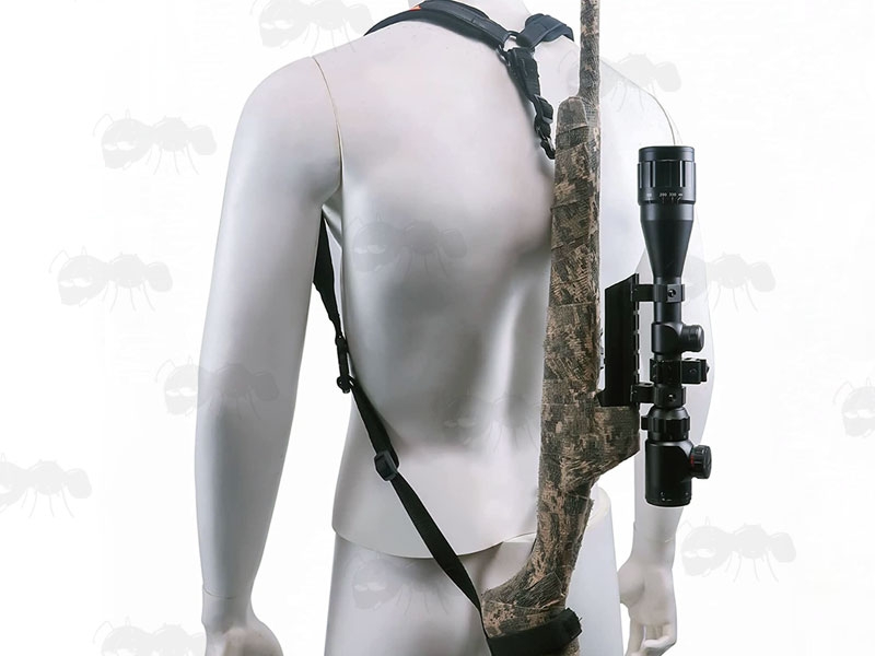 Black Canvas and High-Visibility Neoprene Backpack Harness Style Rifle Sling Shown Over Shoulders Fitted to a ACU Camo Wrapped Rifle