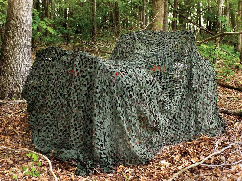 3D Leaf Military Style Camo Netting With Reinforced Mesh in Use in Woodland