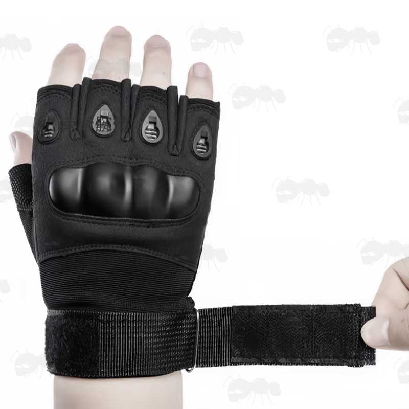 Fitting the Velcro Strap on The Tactical Protective Smooth Hard Knuckle Fingerless Right-Hand Glove in Black