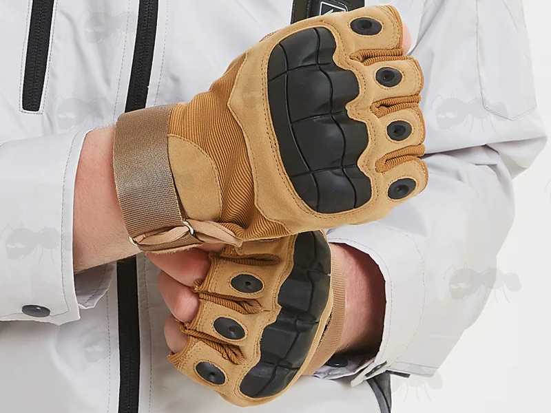 Tactical Protective Hard Knuckle Fingerless Gloves in Tan, Shown in Use