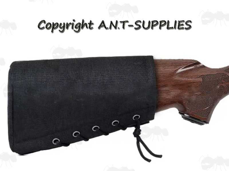 Plain Black Canvas Butt End Cover with Lace-Up Design, Shown Fitted to Wooden Stock