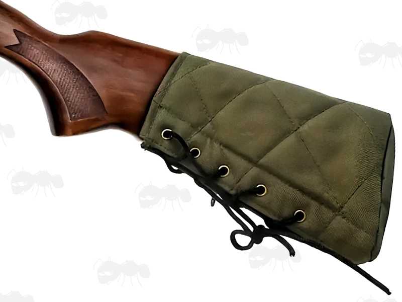 Plain Green Quilted Canvas Butt End Cover with Lace-Up Design, Shown Fitted to Wooden Stock