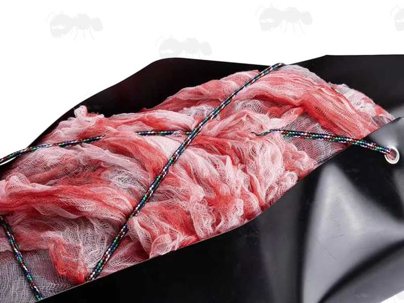 Black Plastic Roll-Up Sled with Two Rolls of Multi-Colour Rope for Big Game Extraction, Shown in Use
