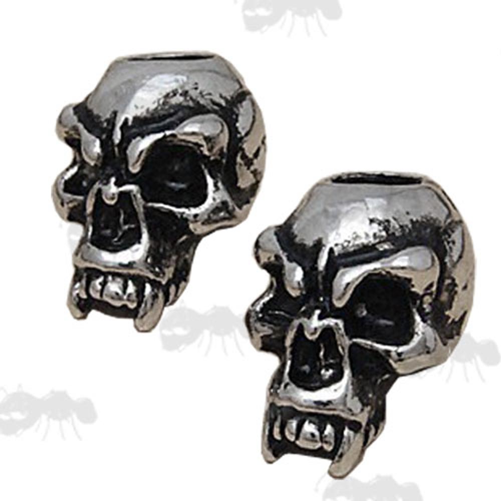 Two Metal Skull Beads with Large Fangs