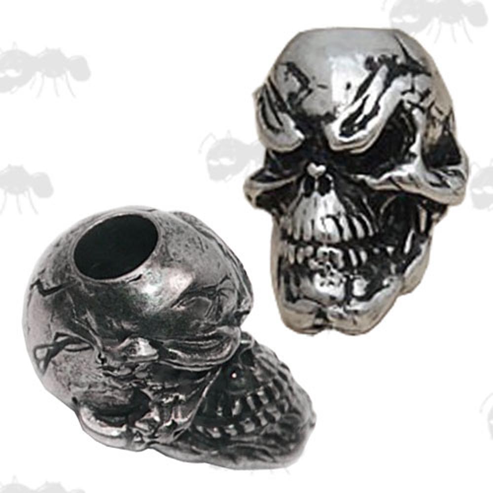 Two Metal Skull Beads with Wide Smiles