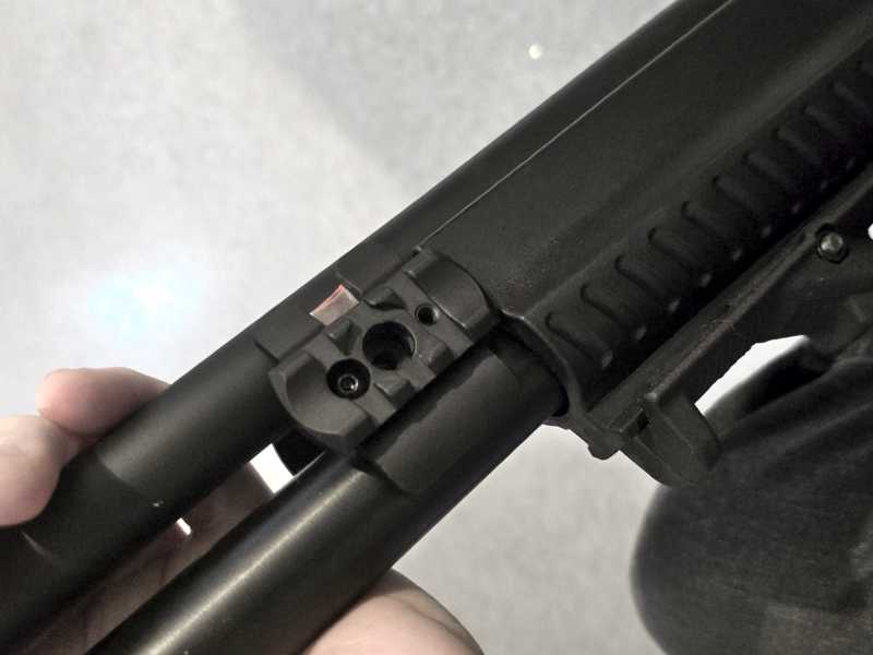 Black Aluminium Shotgun Barrel Magazine Tube Clamp Rail Base Adapter with 10mm Port Push Button Swivel, Shown Fitted to a 12 Gauge Hatsan Escort MP