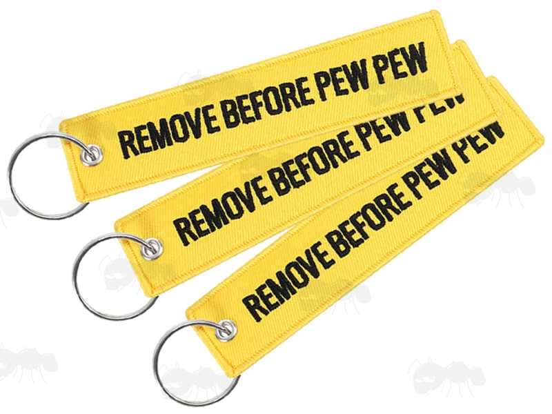 Three Yellow Gun Safety Keyrings with Embroidered Black Thread Remove Before Pew Pew Text