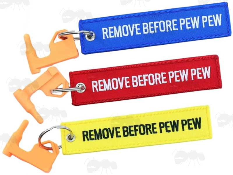 Set of Three Orange Plastic Empty Gun Chamber Safety Plug Tool Fitted with Blue, Red and Yellow Canvas Flag Keychain with White Embroidered Remove Before Pew Pew Text