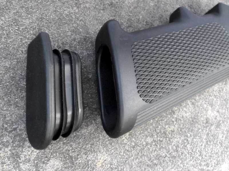 Hollow Grip End View of The Tac Rifle Black Polymer Pistol Grip in Classic A2 Design, Shown with Storage Plug