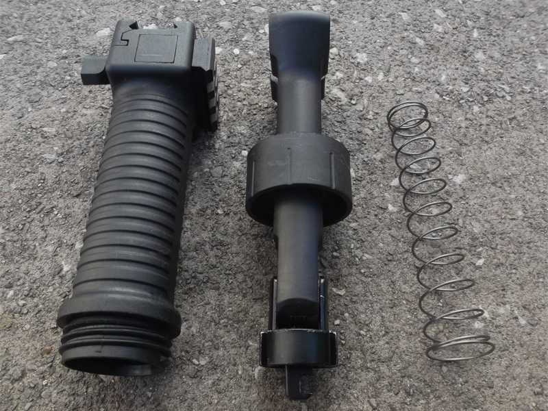 Dismantled View of The Black Airsoft Vertical Grip Bipod with Side Accessory Rail and Telescopic Legs Fitted To A Forend Accessory Rail