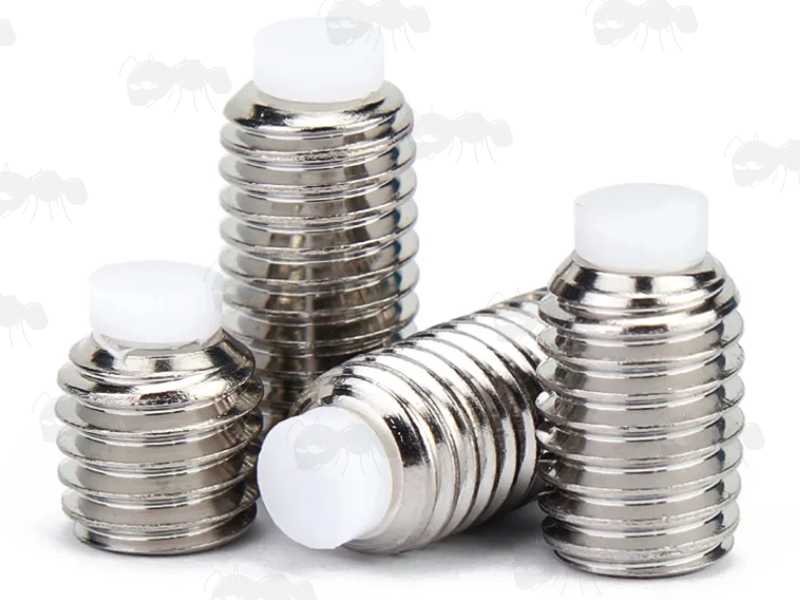 Four Stainless Steel Grub Screws with Hex Socket Heads and White Nylon Tipped Dog Point Ends