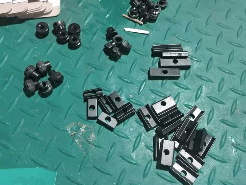 Assortment of Black Anodised Clamp Jaw Plates and Thumb Nuts for Rail Adapters