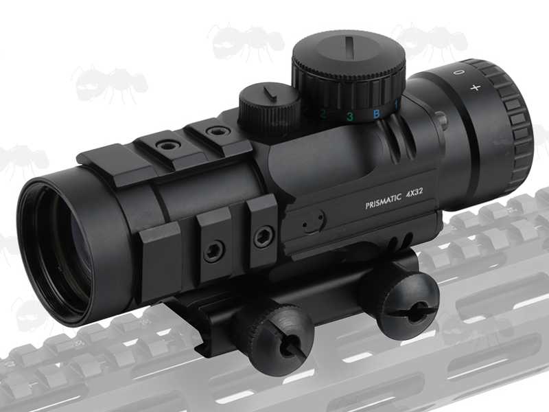 Illuminated 4x32 Prismatic Rifle Scope with Accessory Rails, Shown Fitted to Picatinny Gun Rail