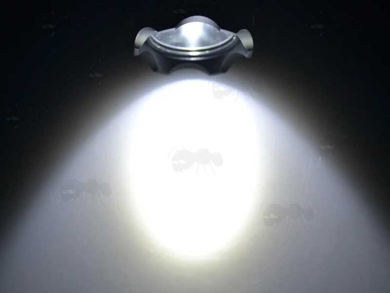 Light Beam View of The Black Aluminium Body Compact LED Tactical Torch Unit with Weaver / Picatinny Gun Rail Mount