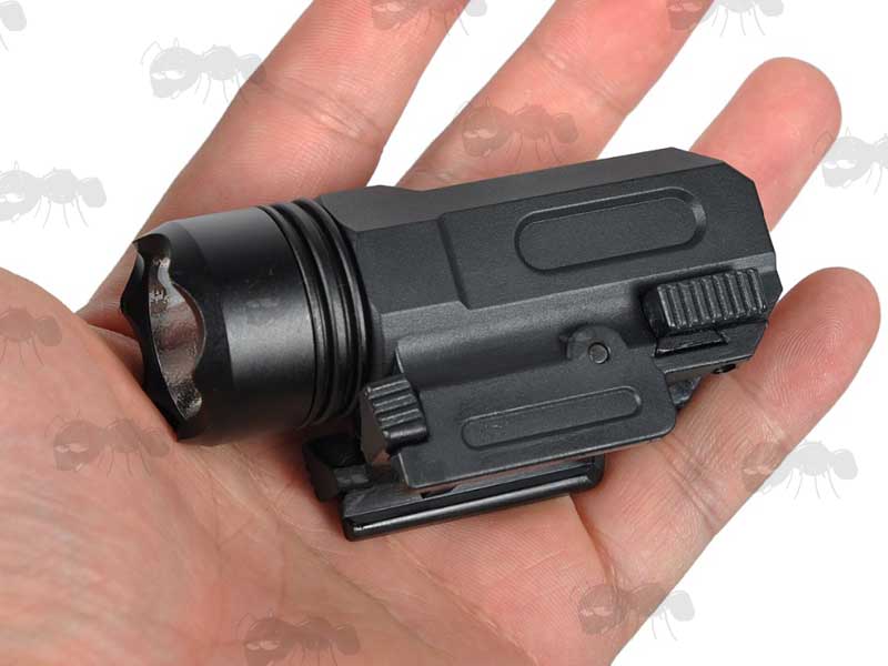 Black Aluminium Body Compact LED Tactical Torch Unit with Weaver / Picatinny Gun Rail Mount Held in Hand