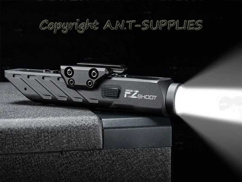 One Piece Inline Design Black Aluminium Body LED Tactical Rifle Torch Unit with Weaver / Picatinny and M-Lok Rifle Rail Mount, Shown Turned-On in Dark Scene