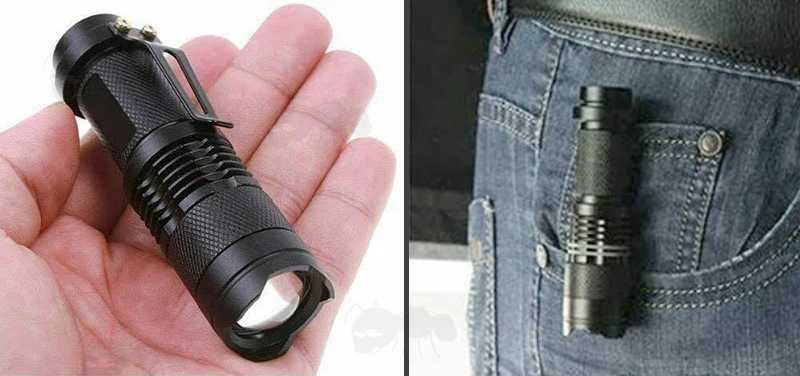 All Black Anodised Metal LED Torch Powered by AA Alkaline or 14500 Lithium-Ion Battery, Shown Fitted to a Pocket on a Pair of Blue Jeans with the Belt Clip