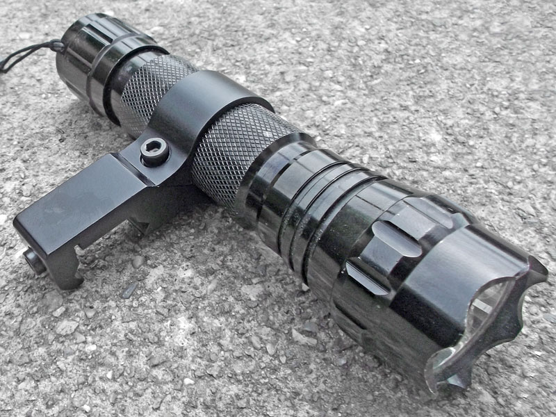 Black, Slim-Profile 25mm Offset Weapon Light Mount for 20mm Weaver / Picatinny Rails Shown with Torch Fitted